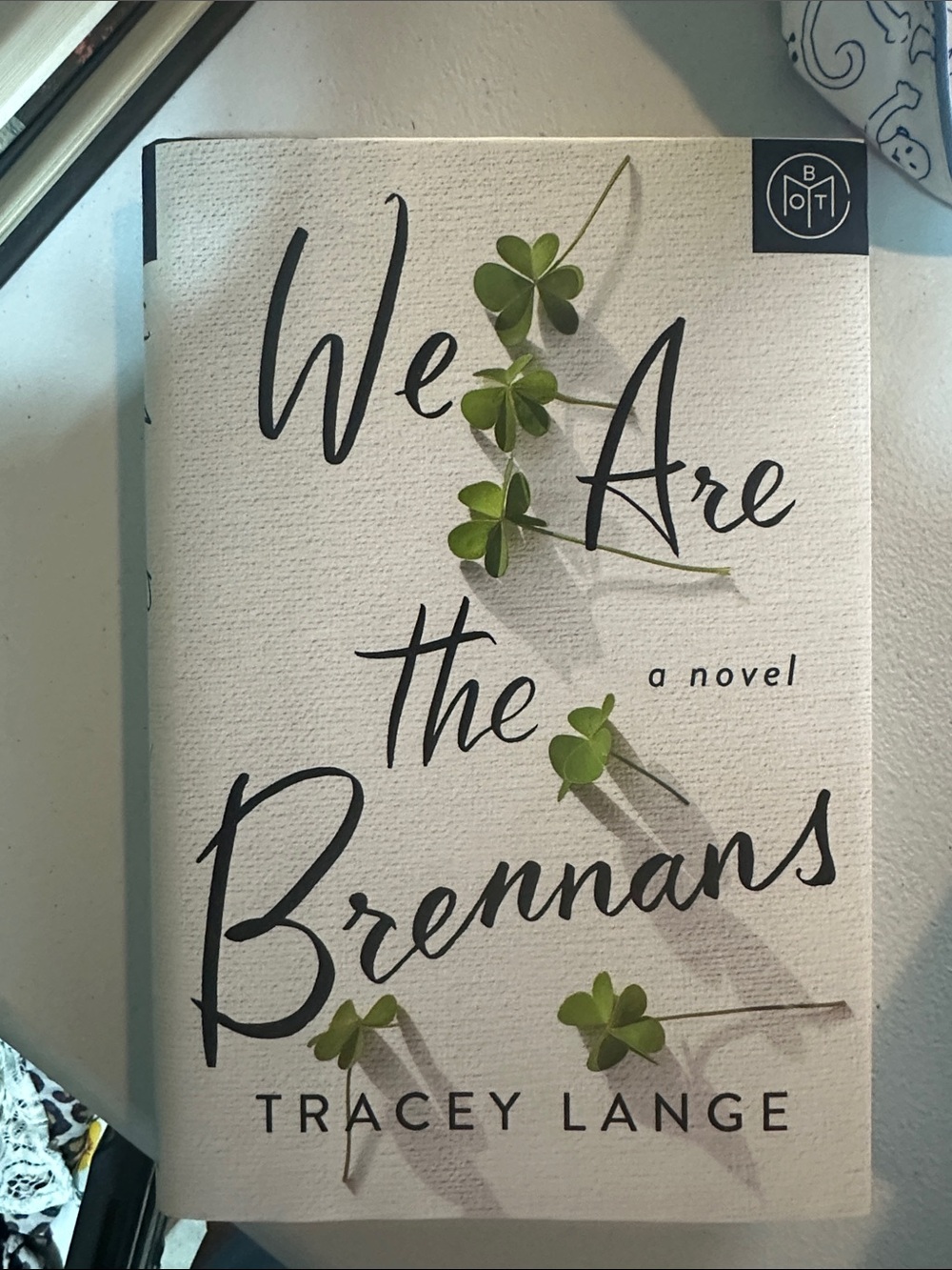 We Are the Brennans by Tracey Lange - White & Green Paperback Novel